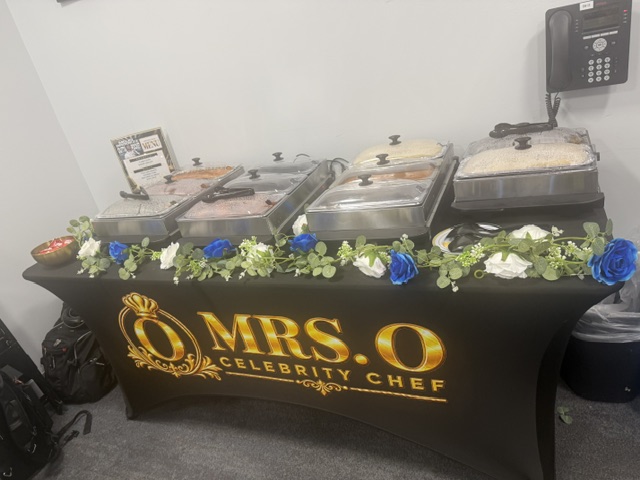 Mrs. O hospitality setup with branded table cover